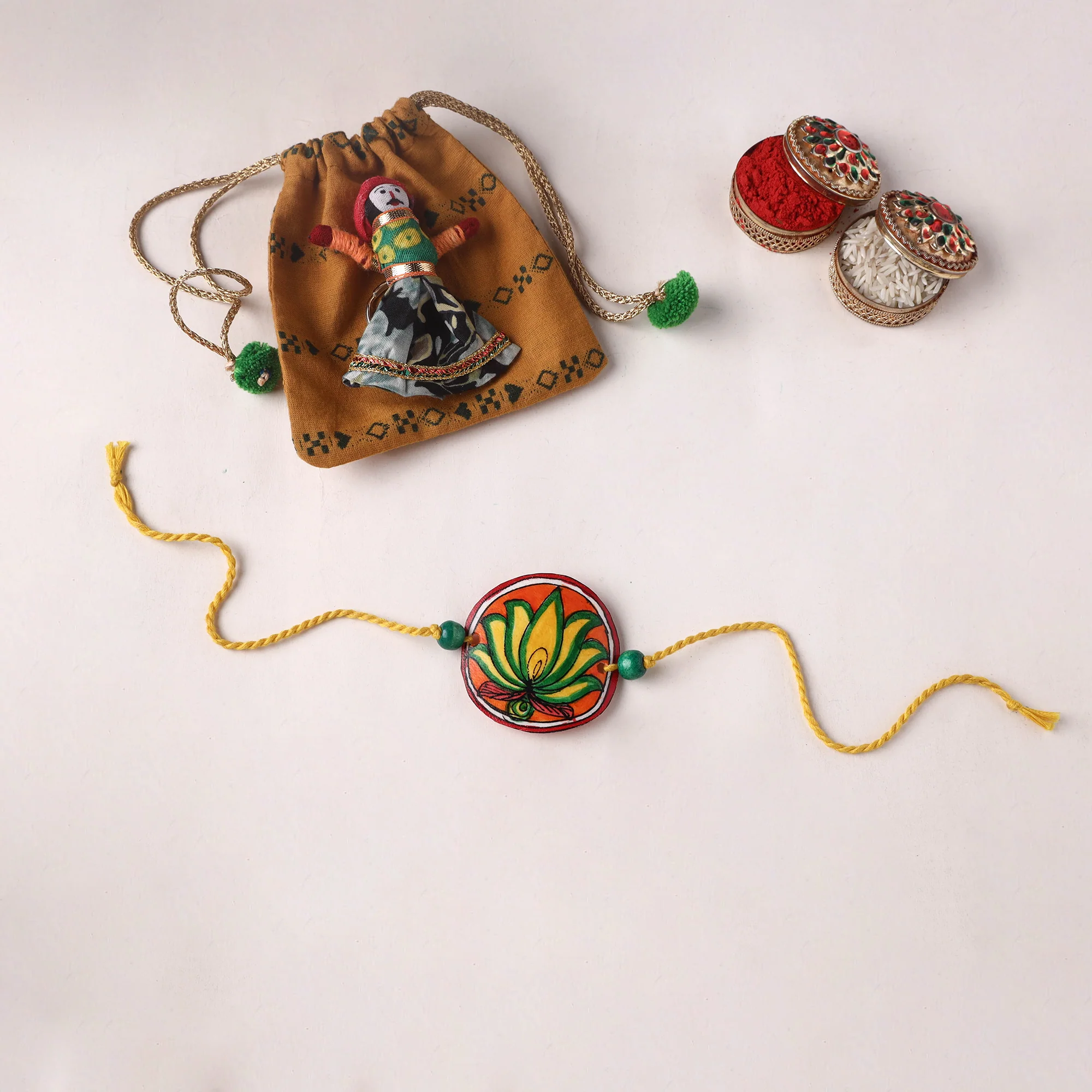 Flower - Handpainted Tholu Bommalata Leather Rakhi (Assorted) 02