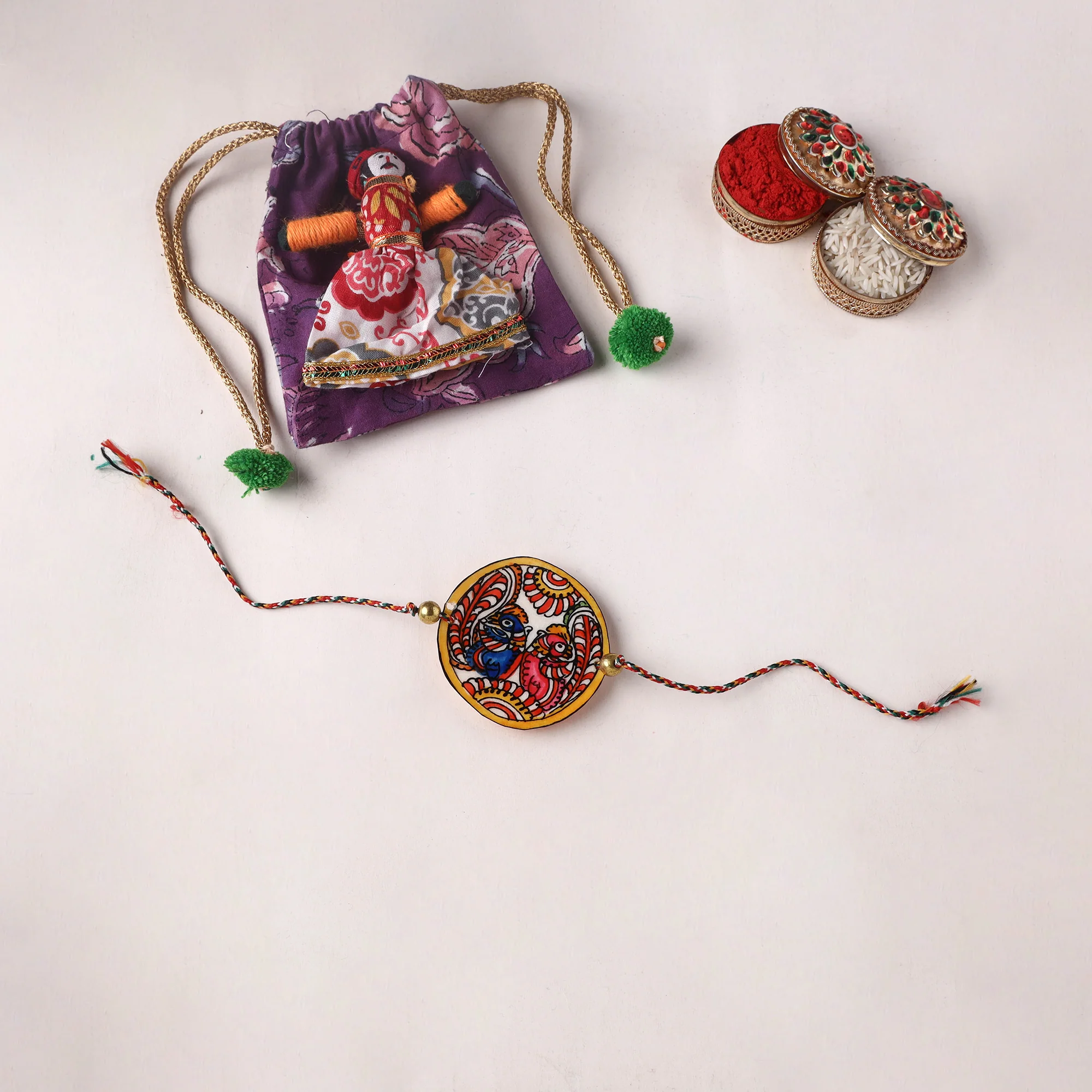Peacocks - Handpainted Tholu Bommalata Leather Rakhi (Assorted) 27